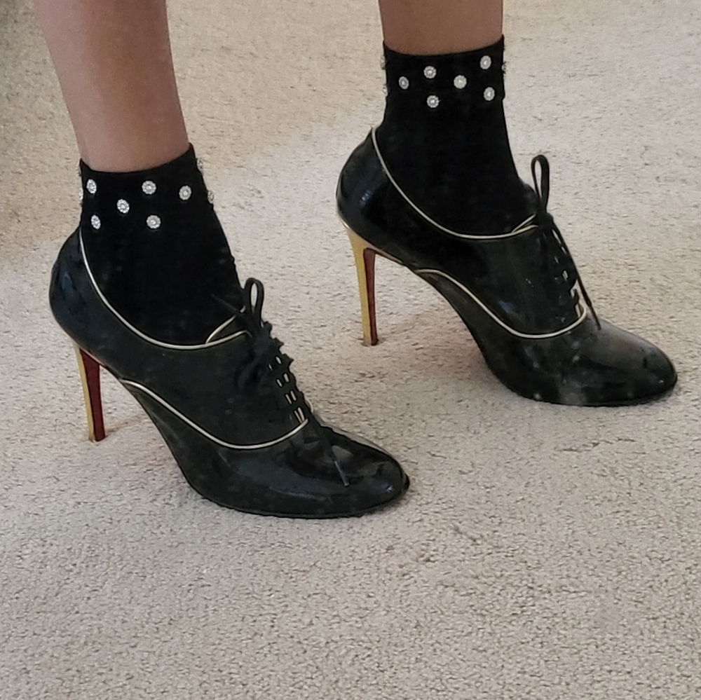 Black lace-up Louboutin booties w/gold detailing
